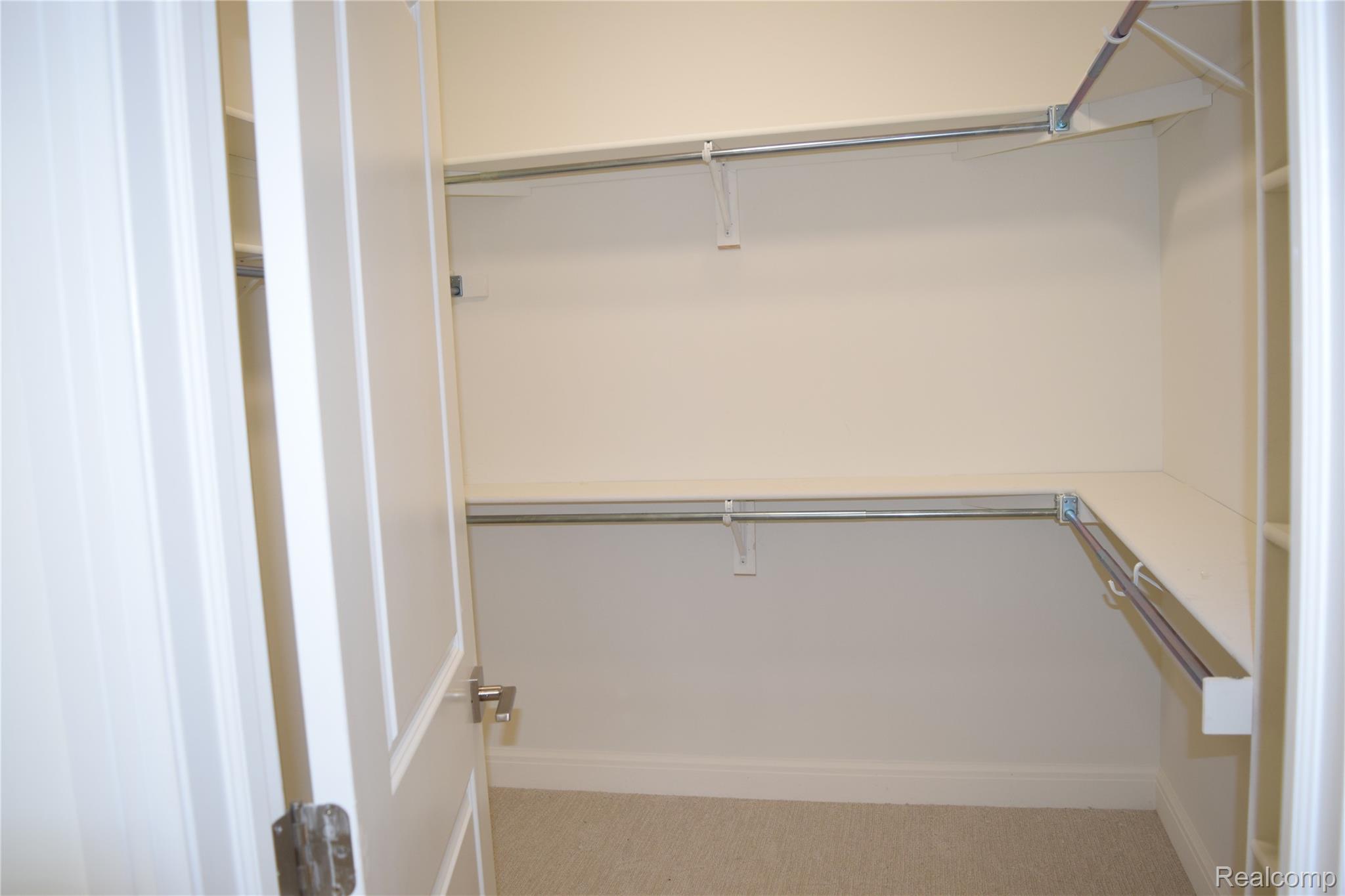 3093 Raffler Drive Rochester, MI 48307 - Photo 27 of 34 Walk in Primary closet with light carpet
