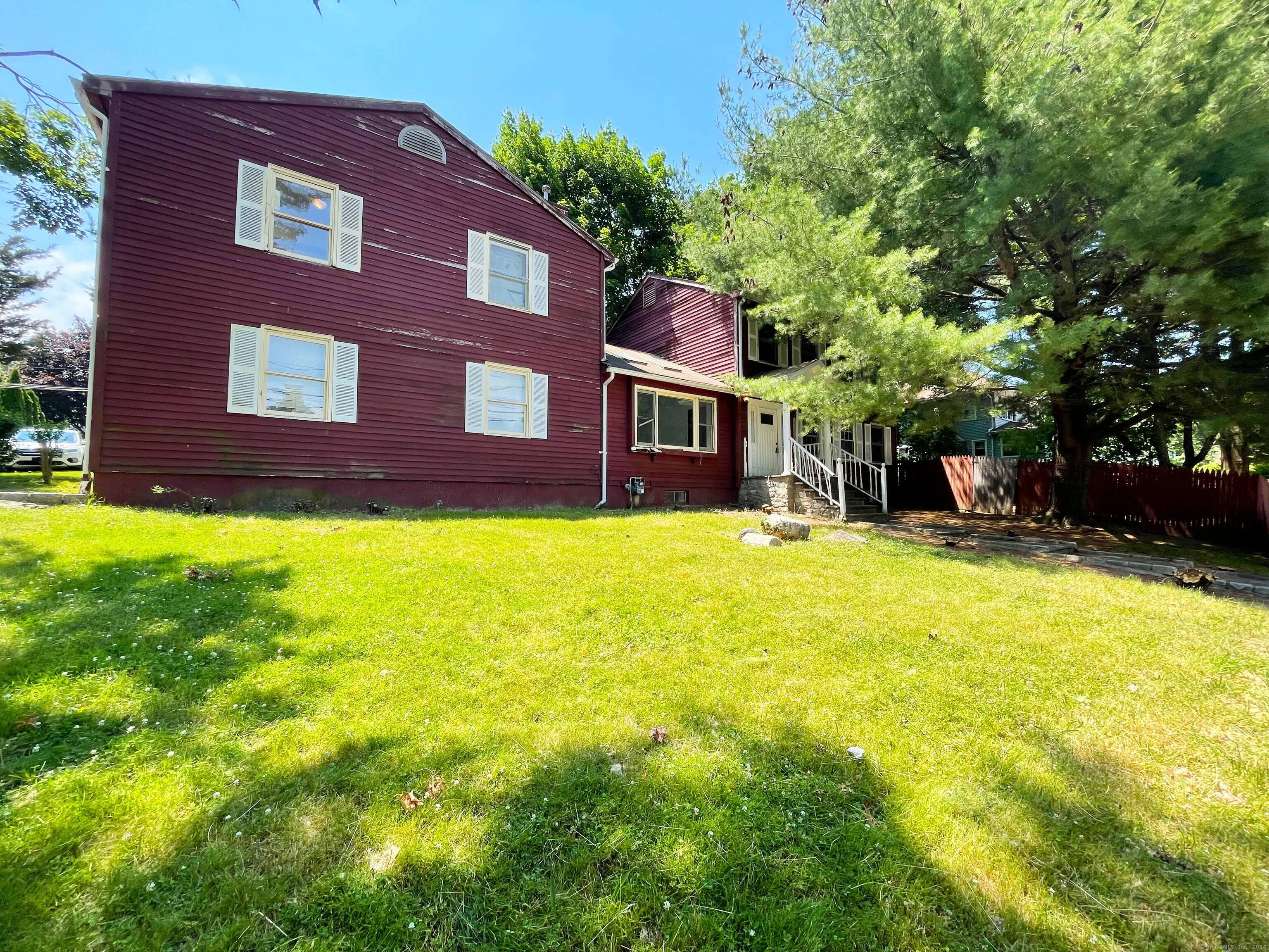 a view of a building with a yard