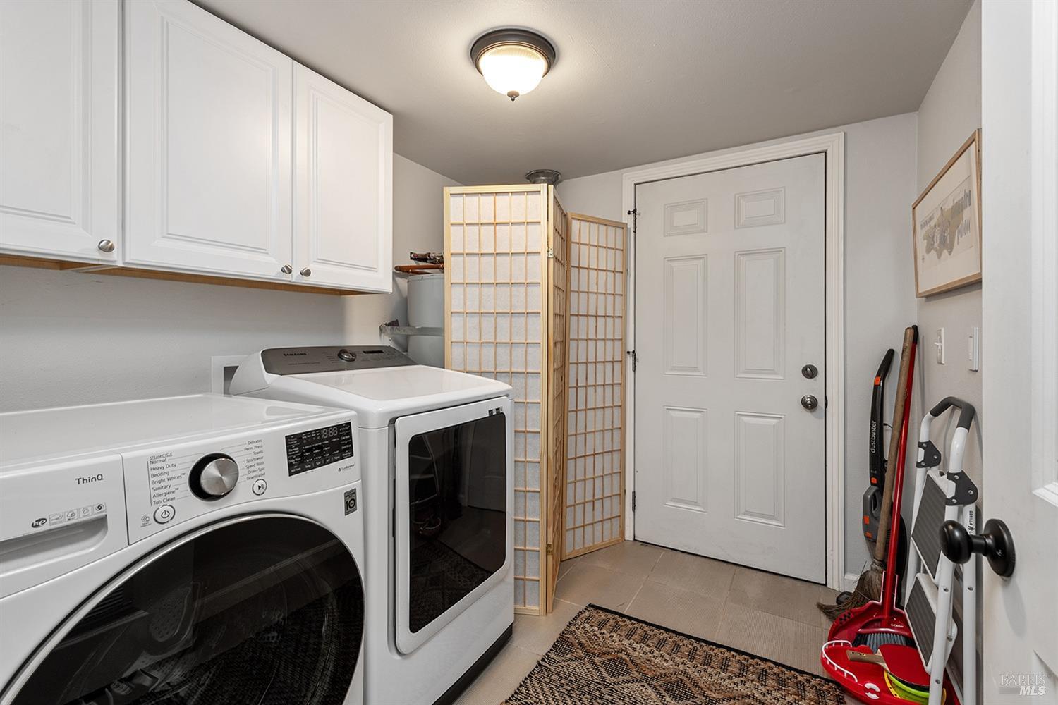 10680 Old River Road Forestville, CA 95436 - Photo 33 of 37 a view of a storage and utility room with washer and dryer