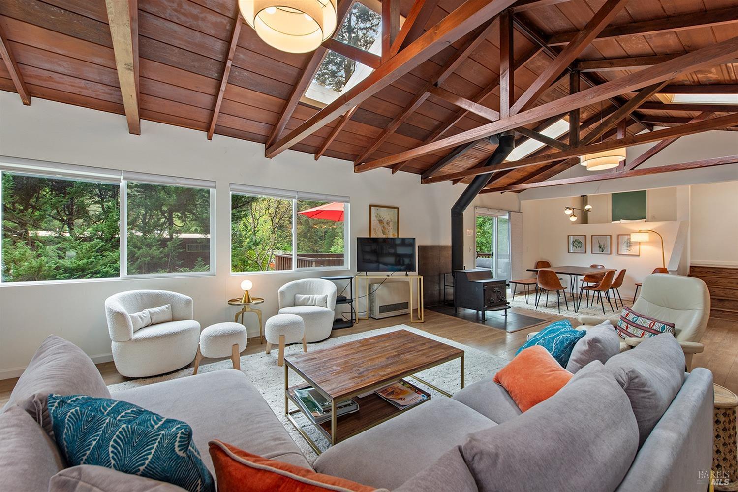 10680 Old River Road Forestville, CA 95436 - Photo 7 of 37 a living room with furniture a fireplace and a table