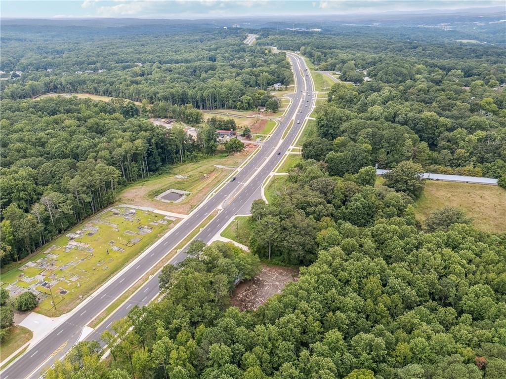 4527 Cumming Highway Canton, GA 30115 - Photo 4 of 8 a view of a lush green field