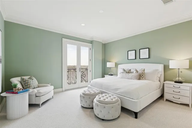 a bedroom with a bed and a couch