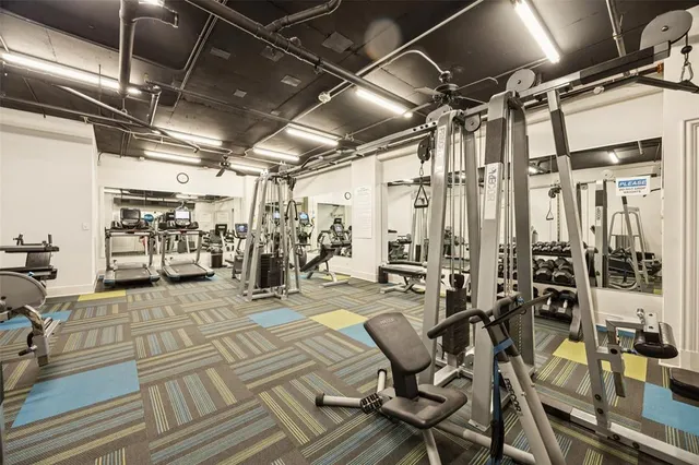 a view of a room with lots of wooden furniture