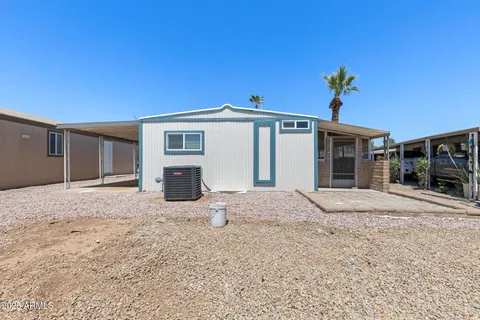 a view of a house with a yard and garage