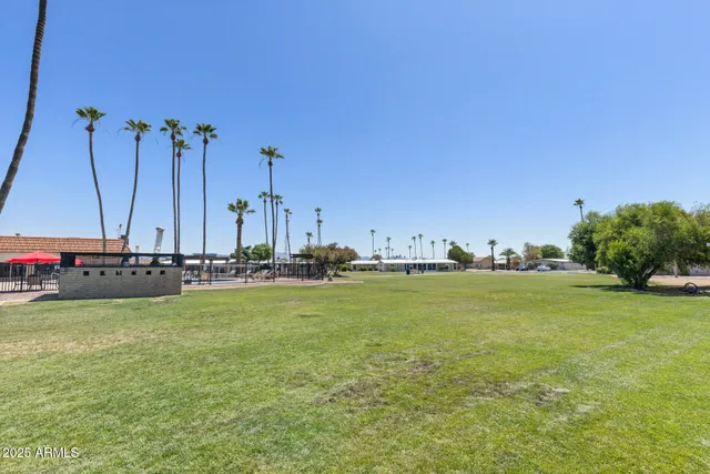 a view of a ocean with boats and trees in the background