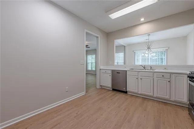 a kitchen with a refrigerator stove and microwave