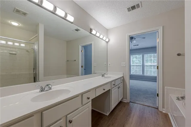 a white bath tub with a shower