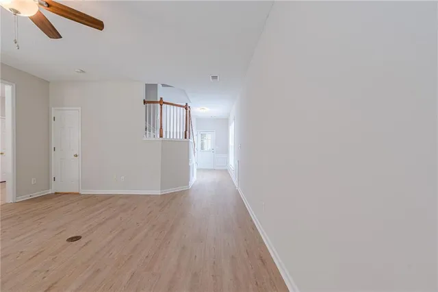 wooden floor in an empty room with a fireplace