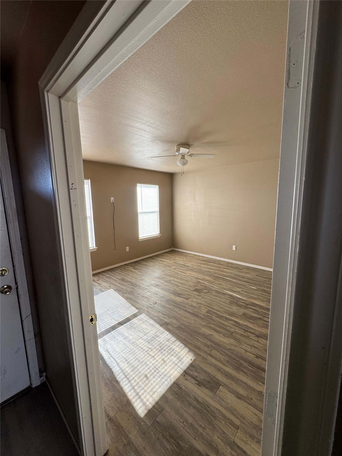 507 49th Street Lubbock, TX 79404 - Photo 15 of 50 wooden floor in an empty room with a window