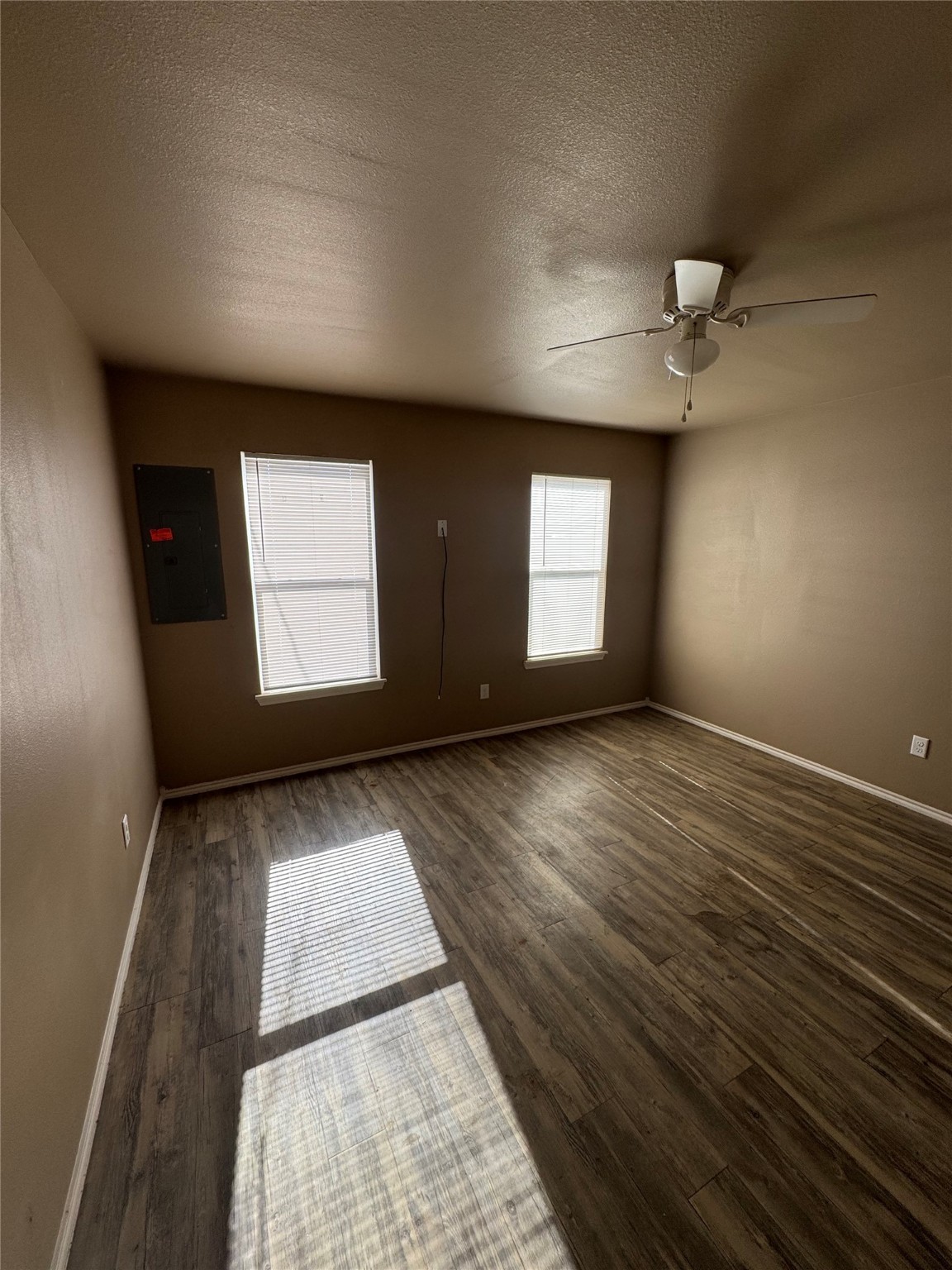 507 49th Street Lubbock, TX 79404 - Photo 16 of 50 an empty room with wooden floor and windows