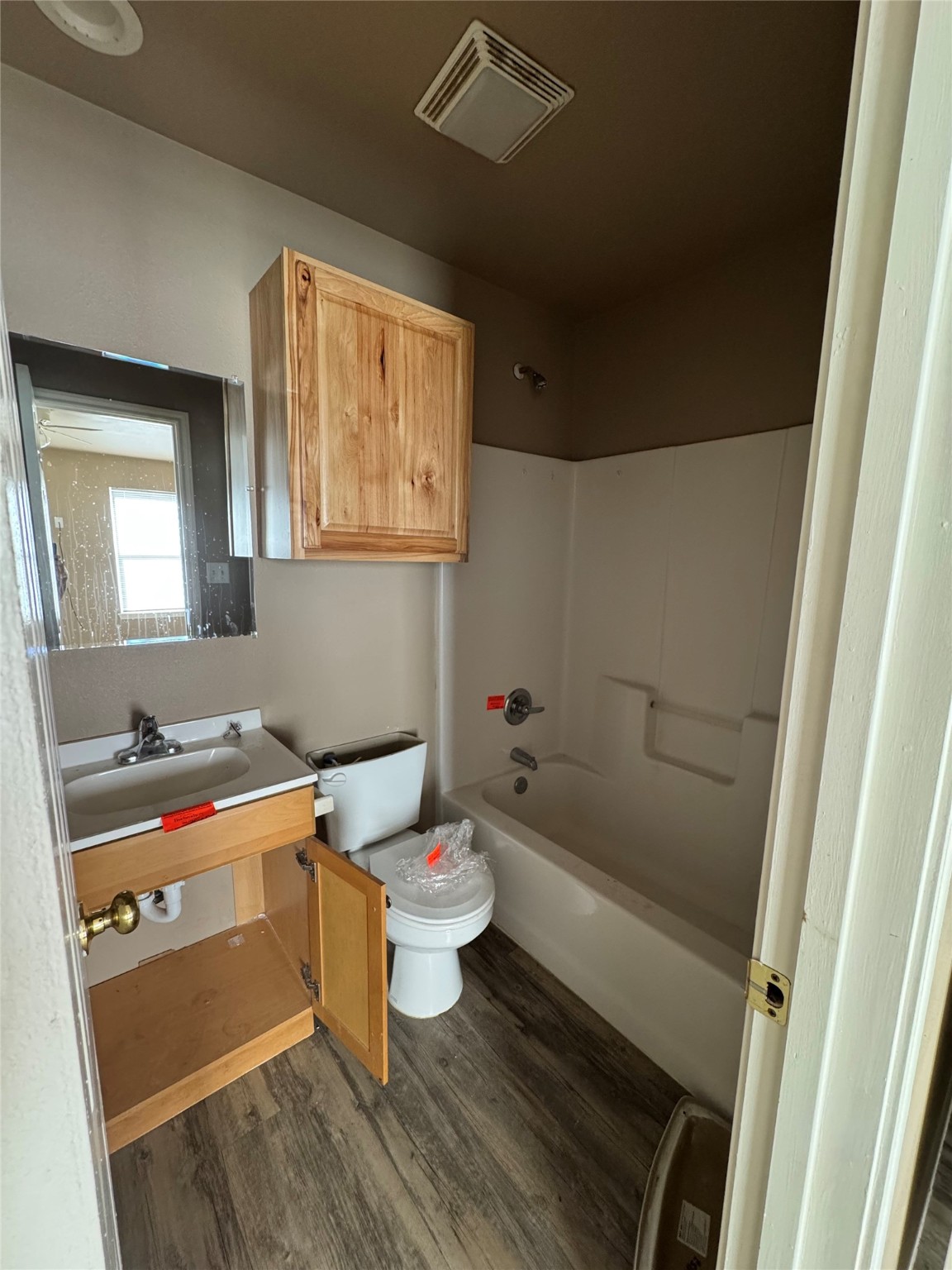 507 49th Street Lubbock, TX 79404 - Photo 24 of 50 a bathroom with a sink and a mirror