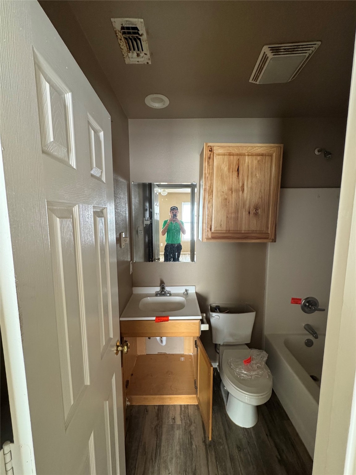 507 49th Street Lubbock, TX 79404 - Photo 28 of 50 a bathroom with a toilet and a sink