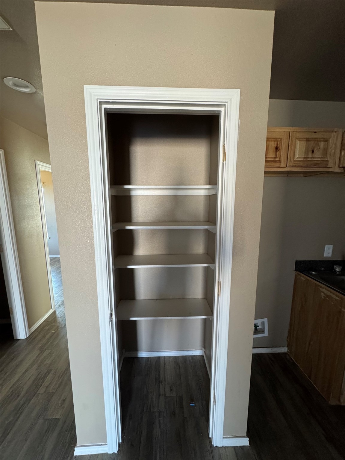 507 49th Street Lubbock, TX 79404 - Photo 36 of 50 a room with a closet and wooden floor