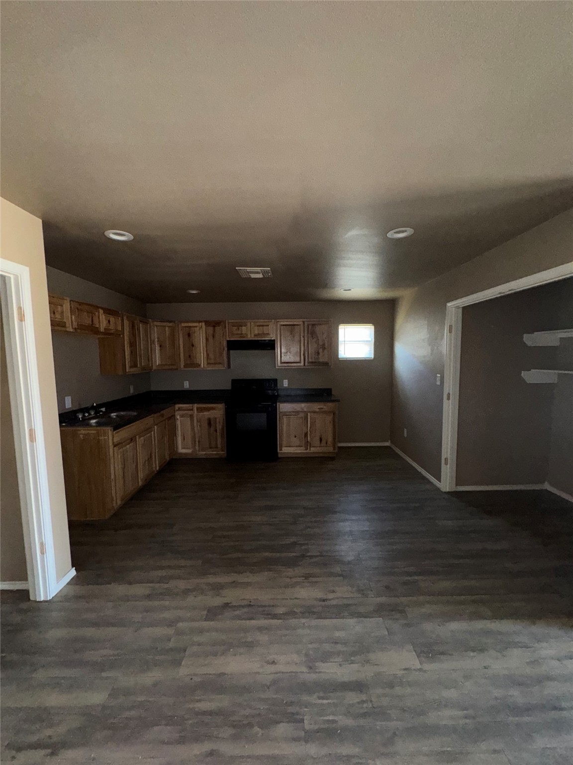 507 49th Street Lubbock, TX 79404 - Photo 7 of 50 a view of kitchen and hall with wooden floor