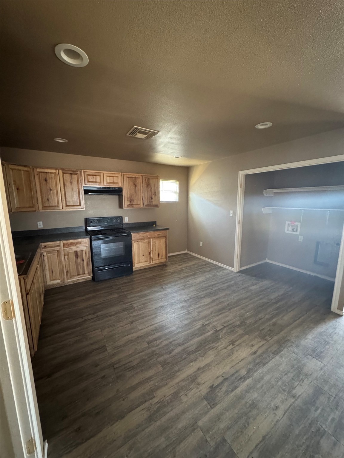 507 49th Street Lubbock, TX 79404 - Photo 8 of 50 a kitchen with granite countertop a stove and cabinets