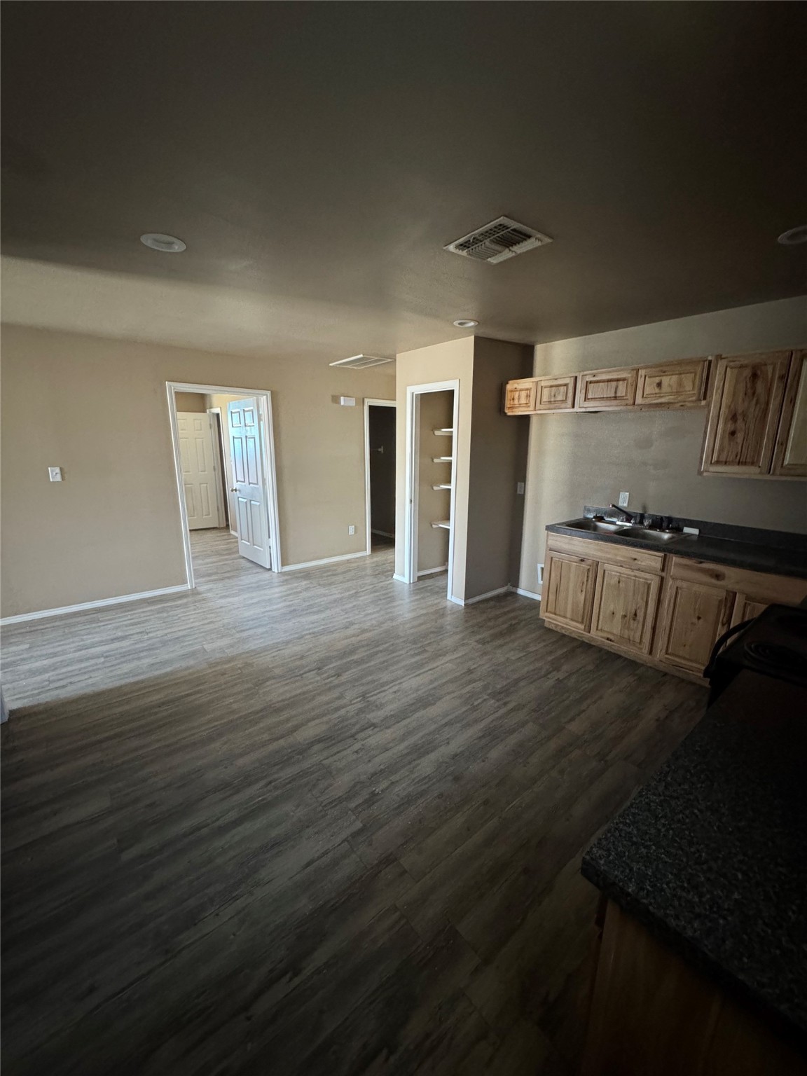 507 49th Street Lubbock, TX 79404 - Photo 9 of 50 wooden floor in an empty room with a fireplace