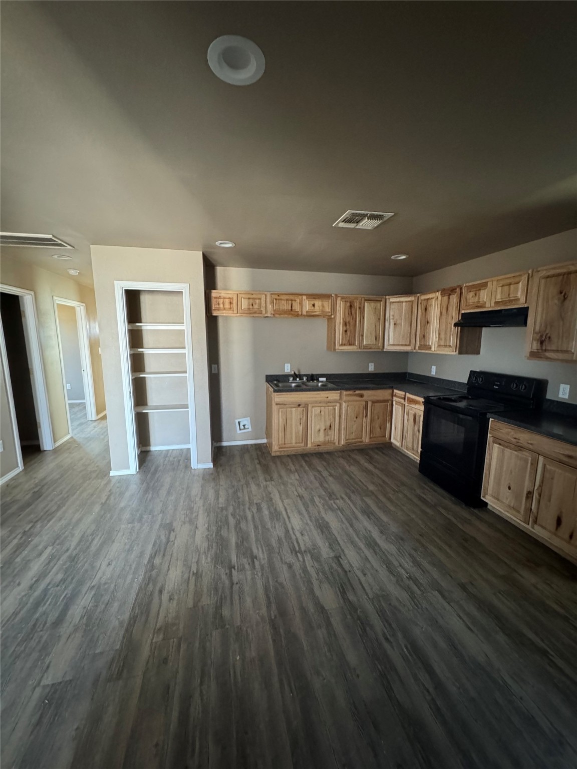 507 49th Street Lubbock, TX 79404 - Photo 10 of 50 an empty room with wooden floor and entrance