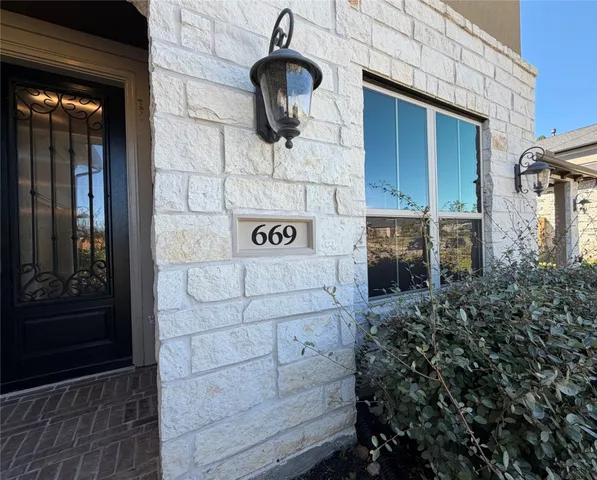 a view of a door and chair in the house