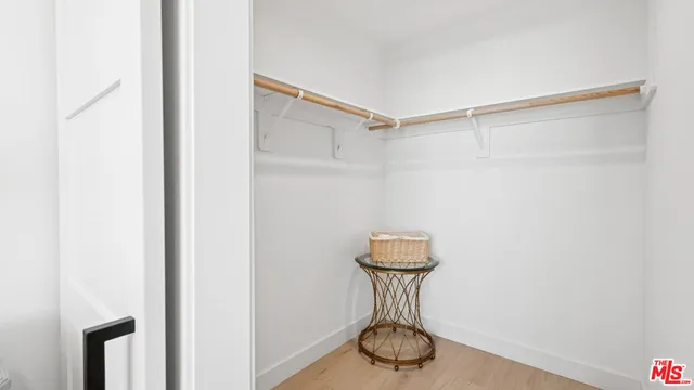a view of storage and utility room with racks on the wall