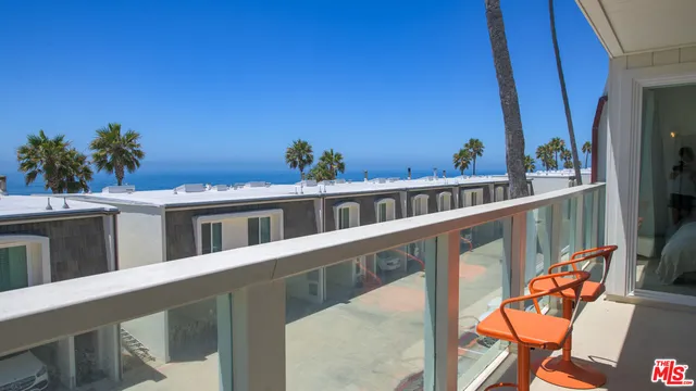 a view of a balcony with chairs