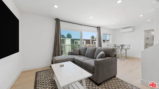a living room with furniture and a rug