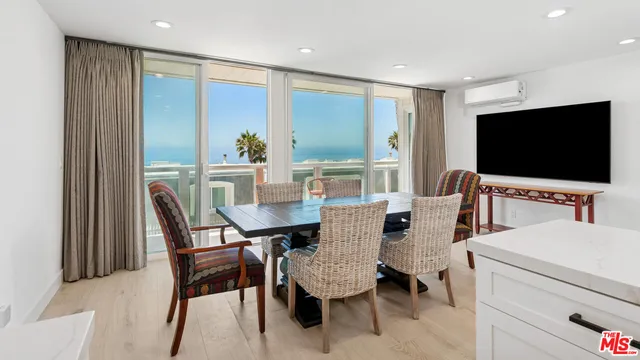 a view of a livingroom with furniture and a flat screen tv