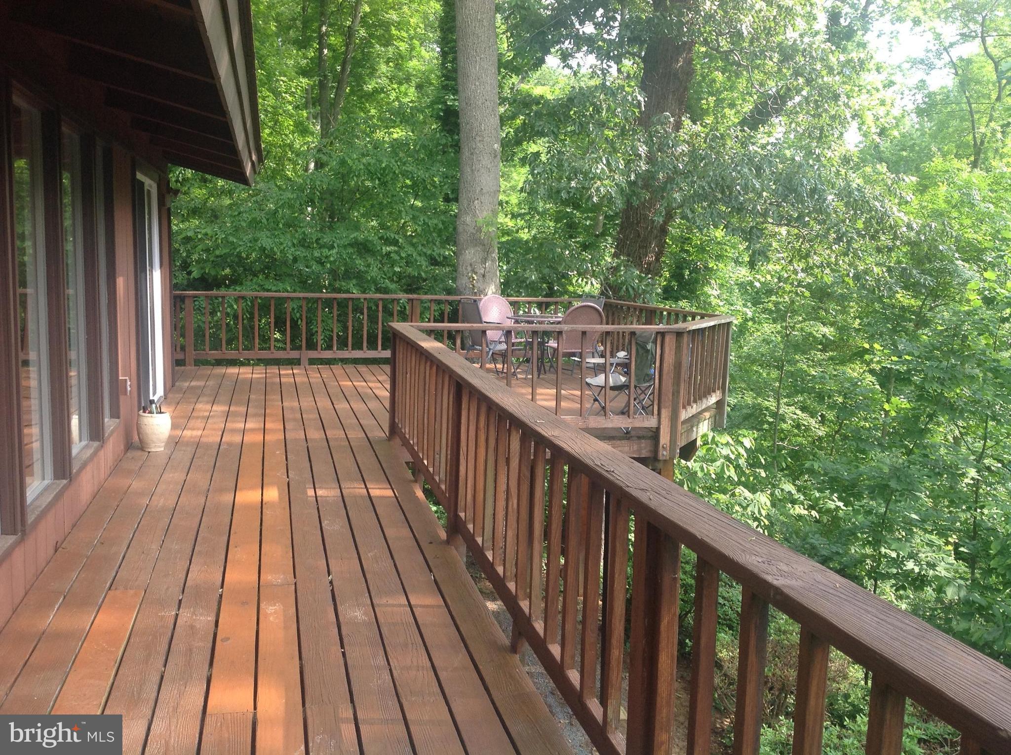 2773 Allspice Road Port Republic, MD 20676 - Photo 13 of 26 Huge deck facing the woods!