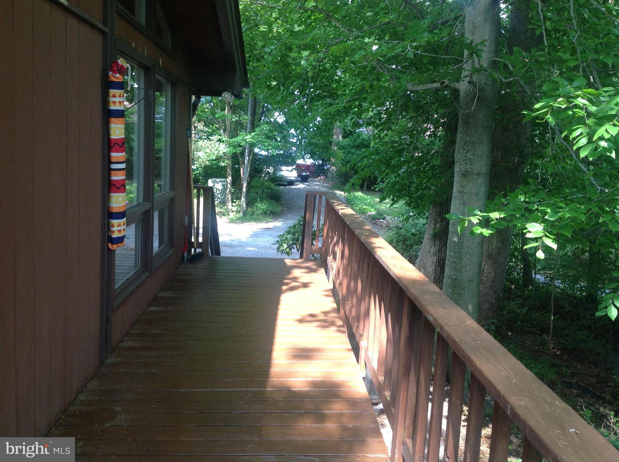 2773 Allspice Road Port Republic, MD 20676 - Photo 17 of 26 Decking from parking to rear deck.