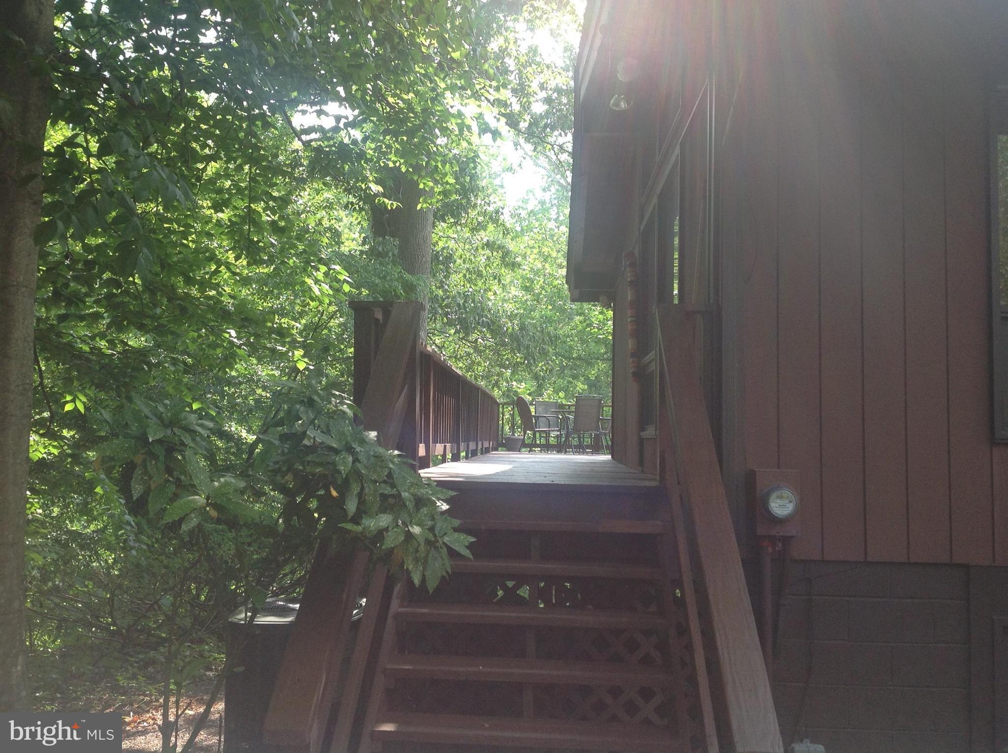 2773 Allspice Road Port Republic, MD 20676 - Photo 18 of 26 Decking from parking to rear deck.