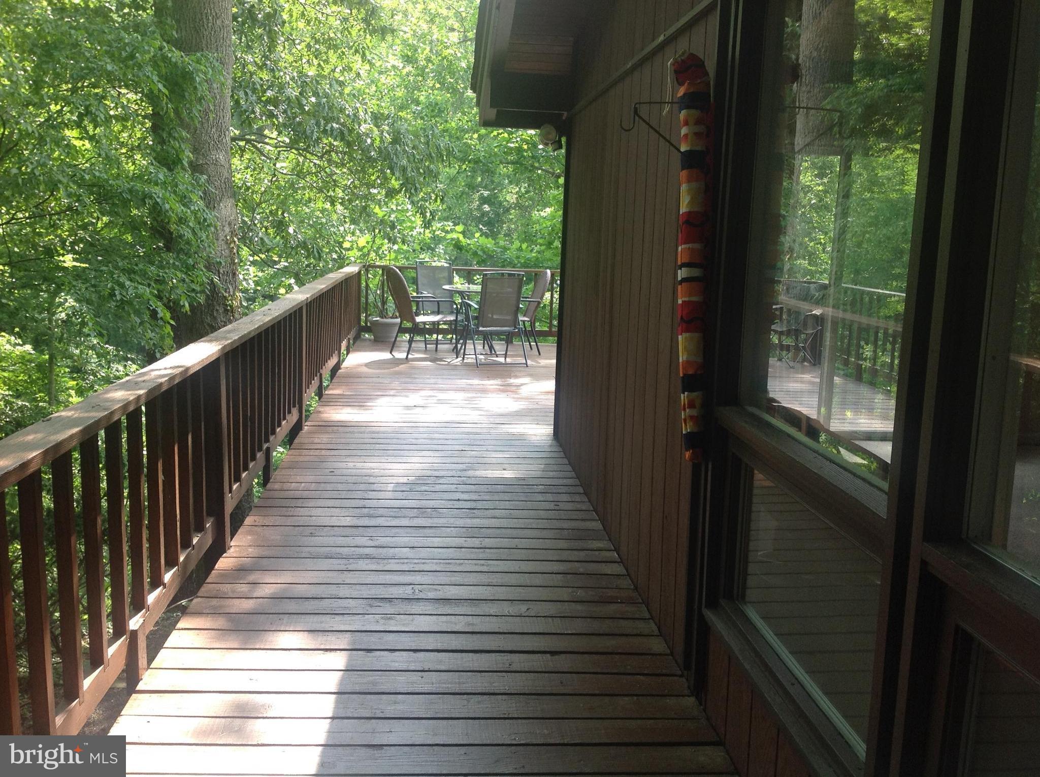 2773 Allspice Road Port Republic, MD 20676 - Photo 19 of 26 Decking from parking to rear deck.