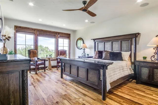 a living room with a bed furniture and a window