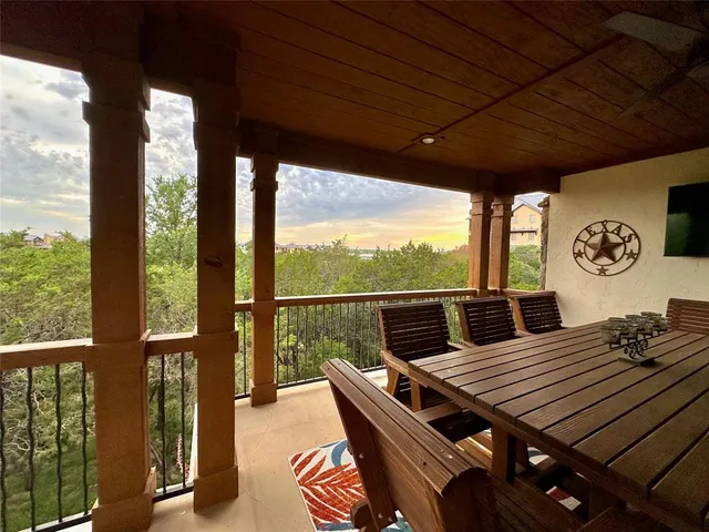 a view of a roof deck with furniture and wooden floor