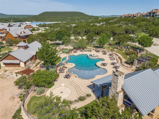 an aerial view of a house with yard