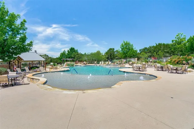 a view of a swimming pool and lounge chair