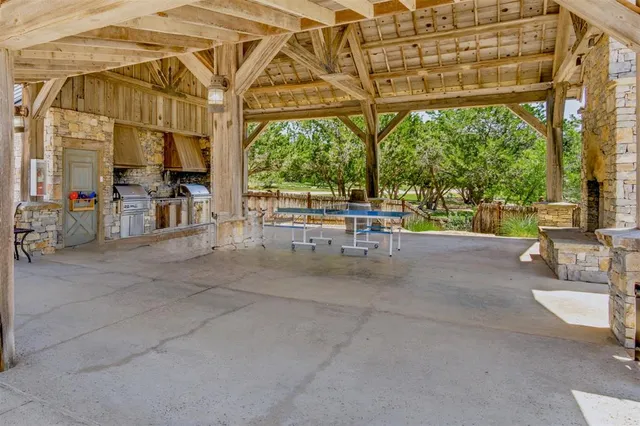 a view of a porch with chairs and backyard