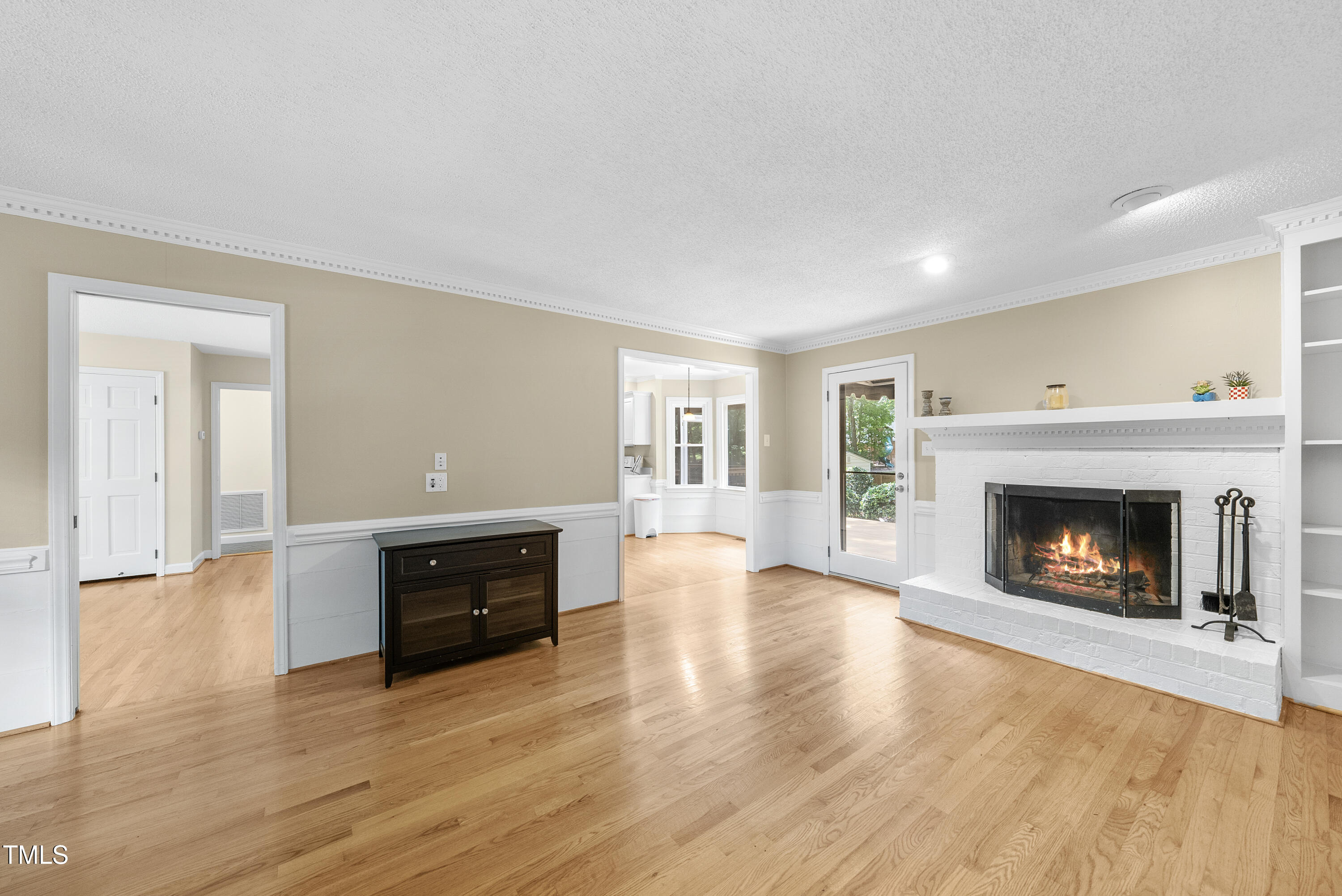 8629 Windjammer Drive Raleigh, NC 27615 - Photo 25 of 56 Family Room with Hardwood Floors and Fireplace