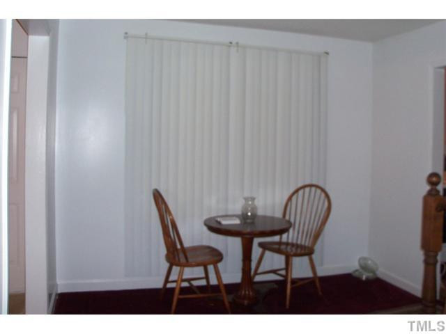 849 Cross Link Road Raleigh, NC 27610 - Photo 4 of 8 a view of a room with a table and chair