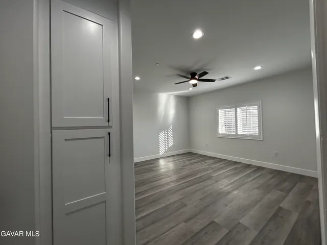 a view of an empty room and a window