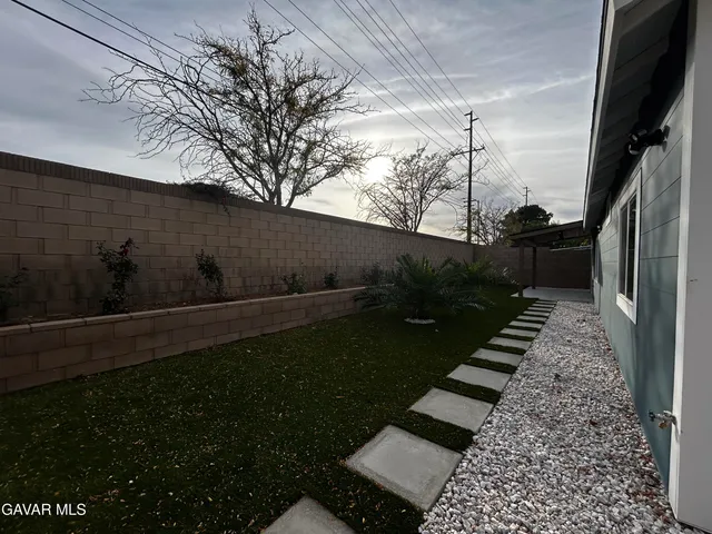 a view of a yard with an outdoor space