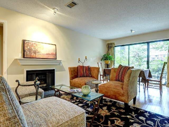 110 Ridley Howard Court Decatur, GA 30030 - Photo 1 of 1 a living room with furniture and a fireplace