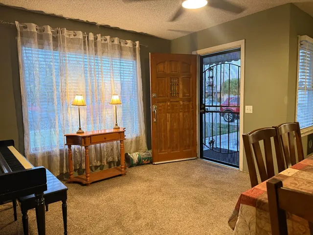 a bedroom with furniture and a window