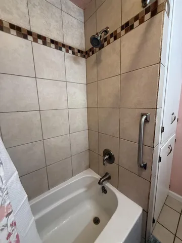 a bathroom with a sink and shower