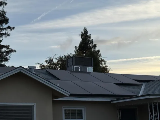 a view of a house with a big yard and sitting area