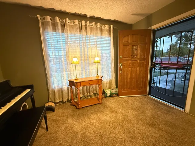 a view of an empty room with a balcony