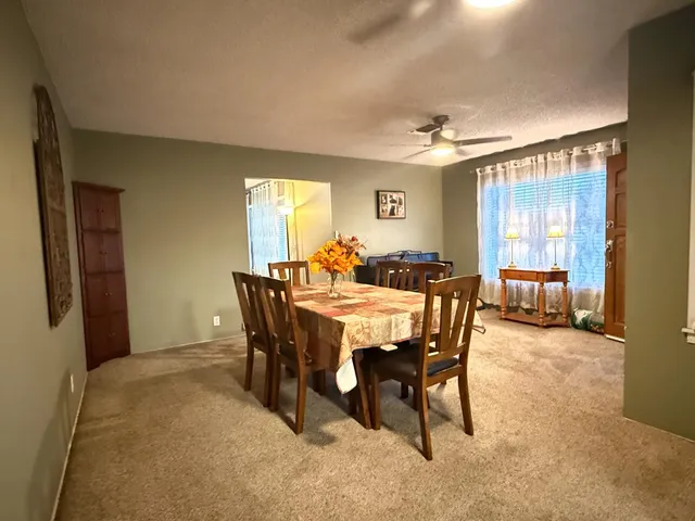 a view of a dining room with furniture
