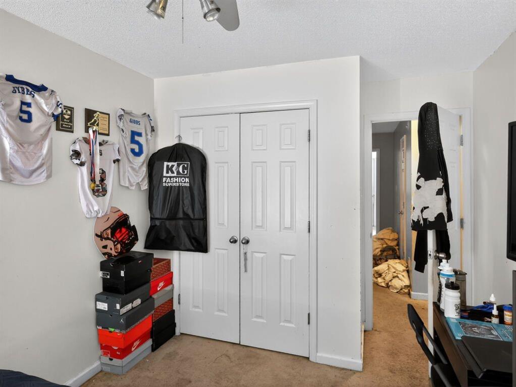 1737 Fielding Way Hampton, GA 30228 - Photo 12 of 17 a view of walk in closet with clothes and shoes