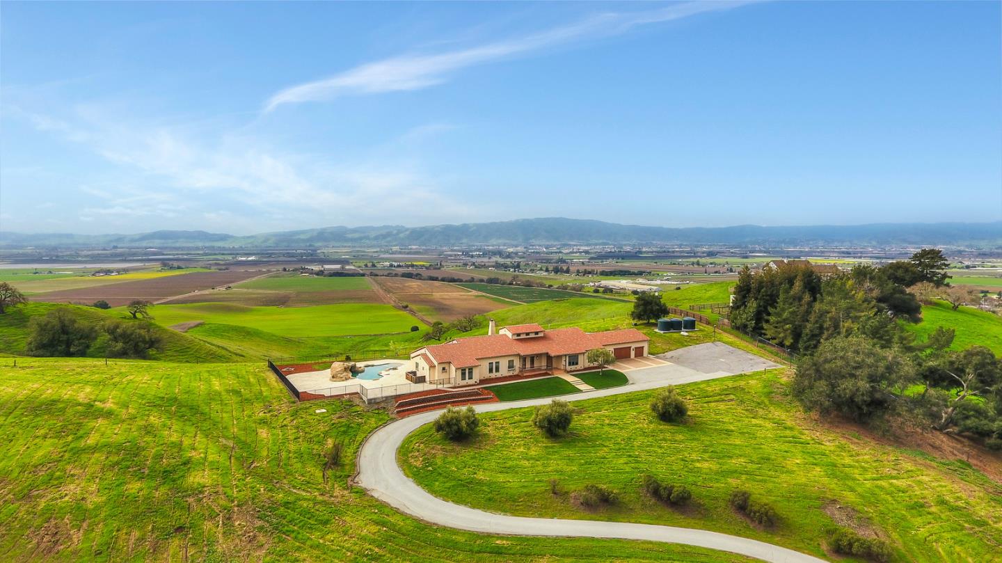 an aerial view of swimming pool with a yard