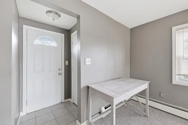 a view of n empty room with a window