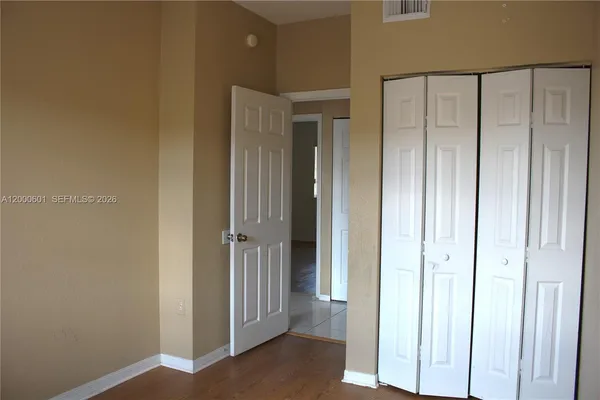 a view of a hallway with closet area