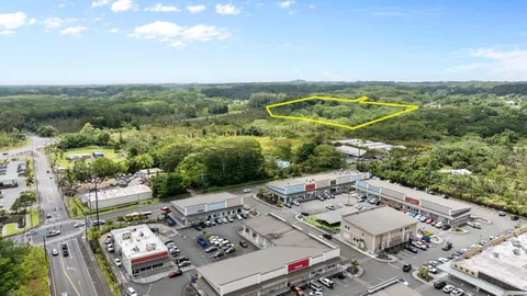 an aerial view of a house with a big yard
